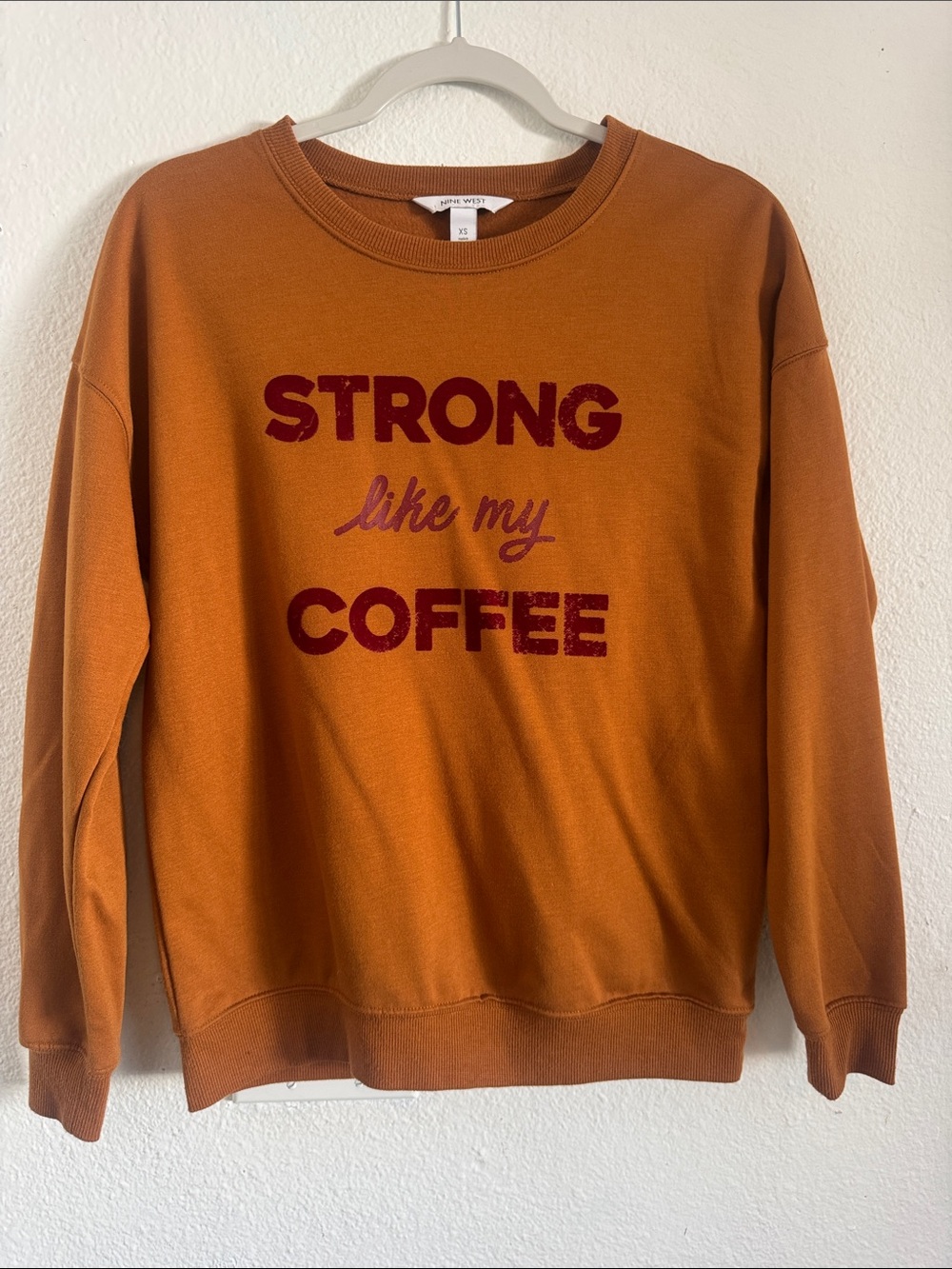 Nine West rust orange crewneck with burgundy text